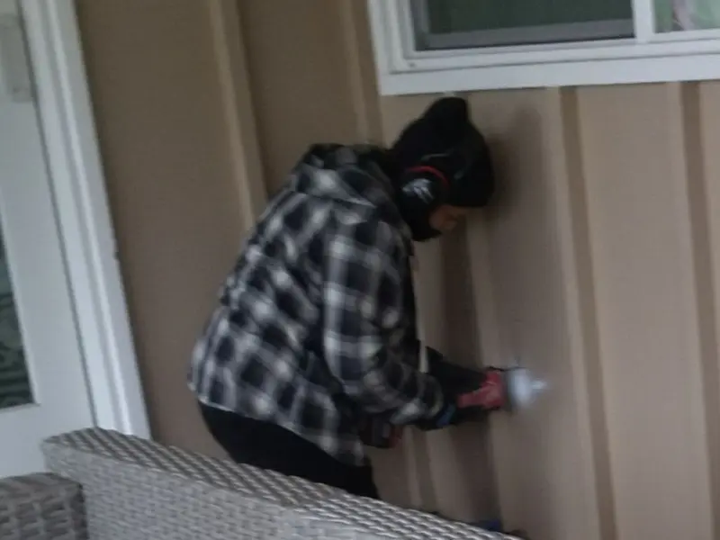 Professional electrician installing an exterior outlet in Eudora
